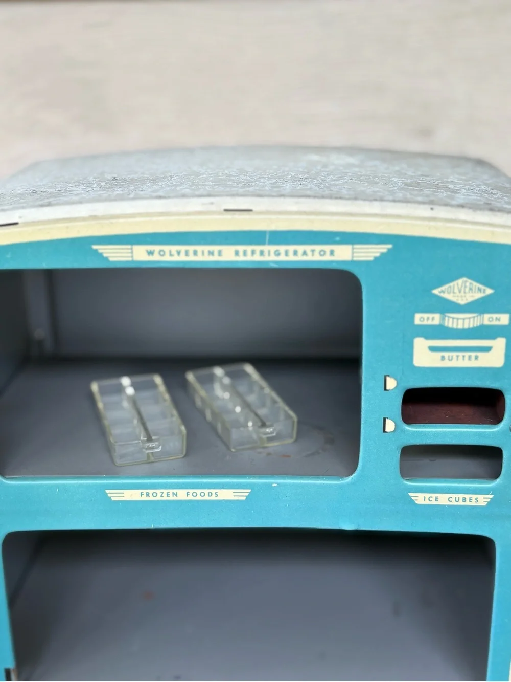 VTG 1950s Wolverine Supply metal toy refrigerator, featuring a white finish